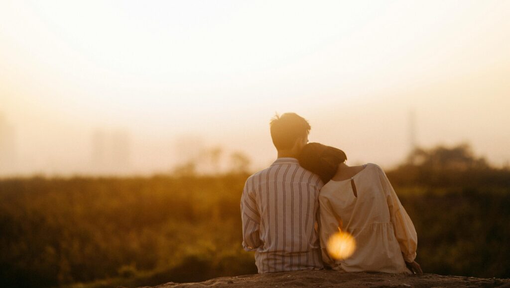 A couple enjoys a serene moment together during a sunset in Gia Lai, Vietnam.
